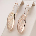 Load image into Gallery viewer, Rose Gold Drop Earrings | Hollow Filigree Oval Design
